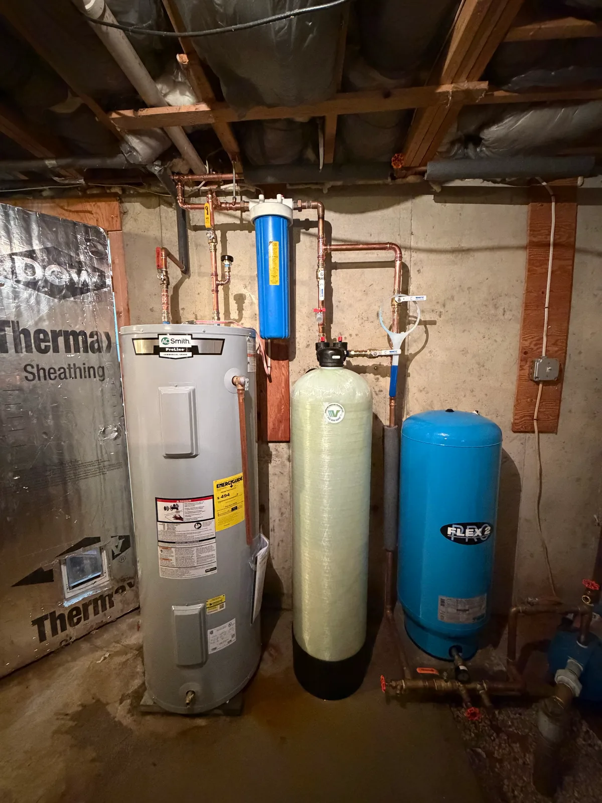 MV Filtration treatment system beside a water heater